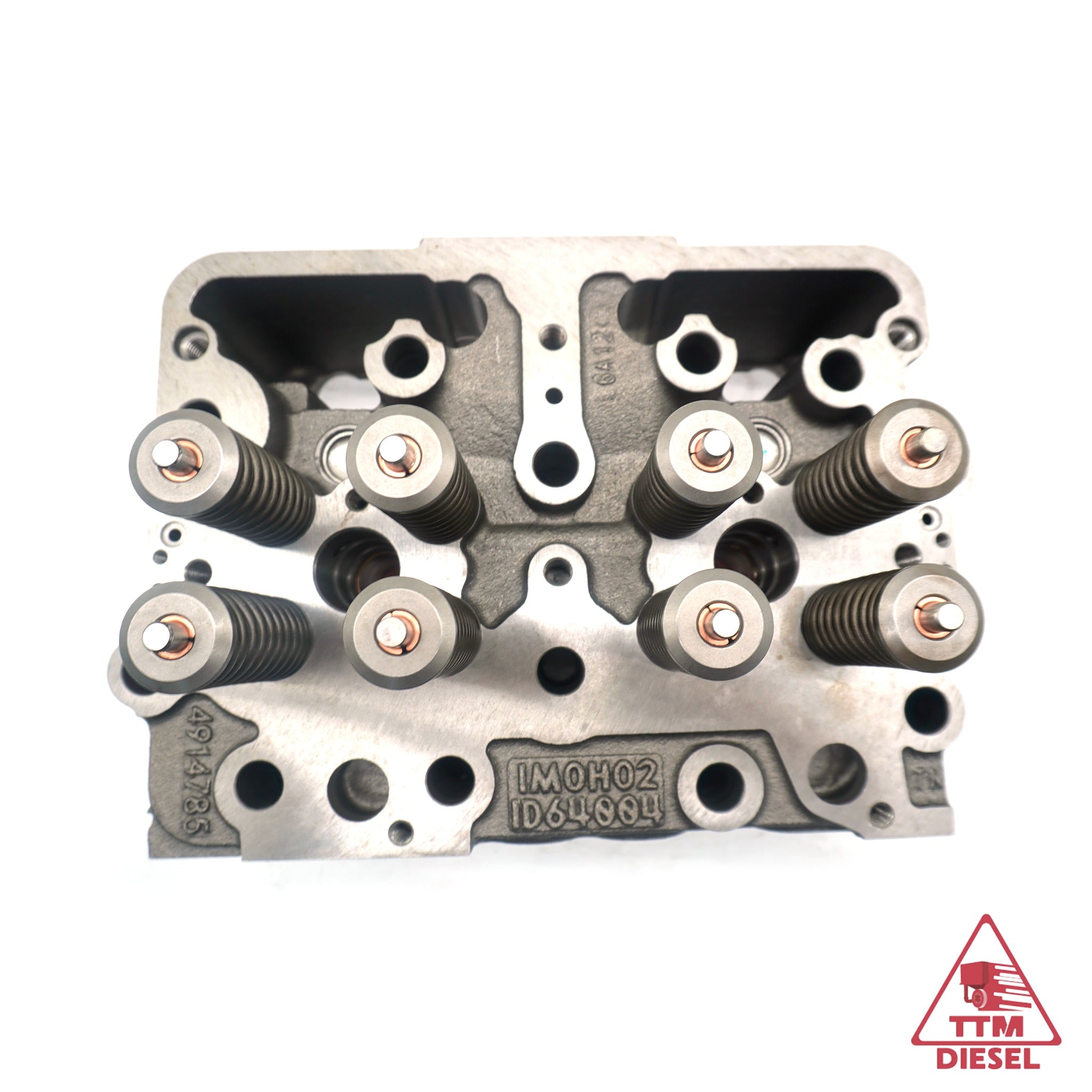 Cummins N14 cylinder head 3078360 top view — injector bores, valve springs and crossheads